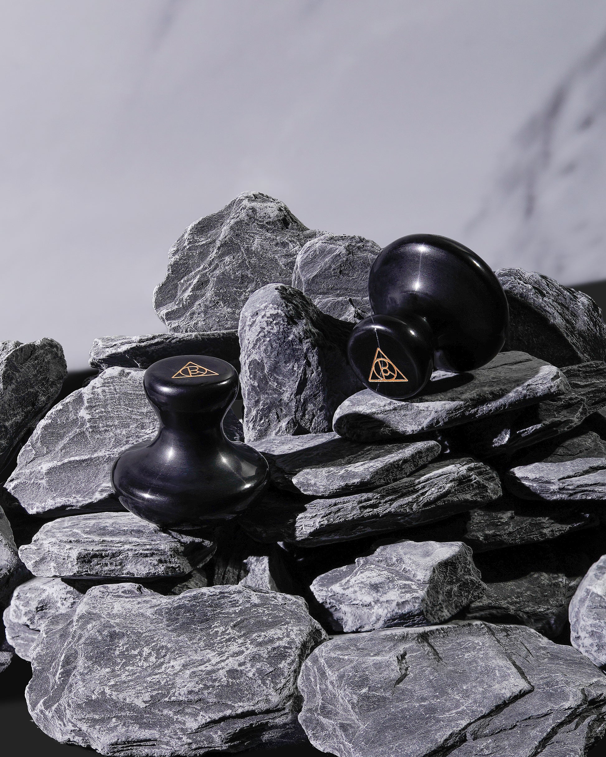 Cult of Reason Mushroom Shaped Gua Sha Stones Pictured on Stones