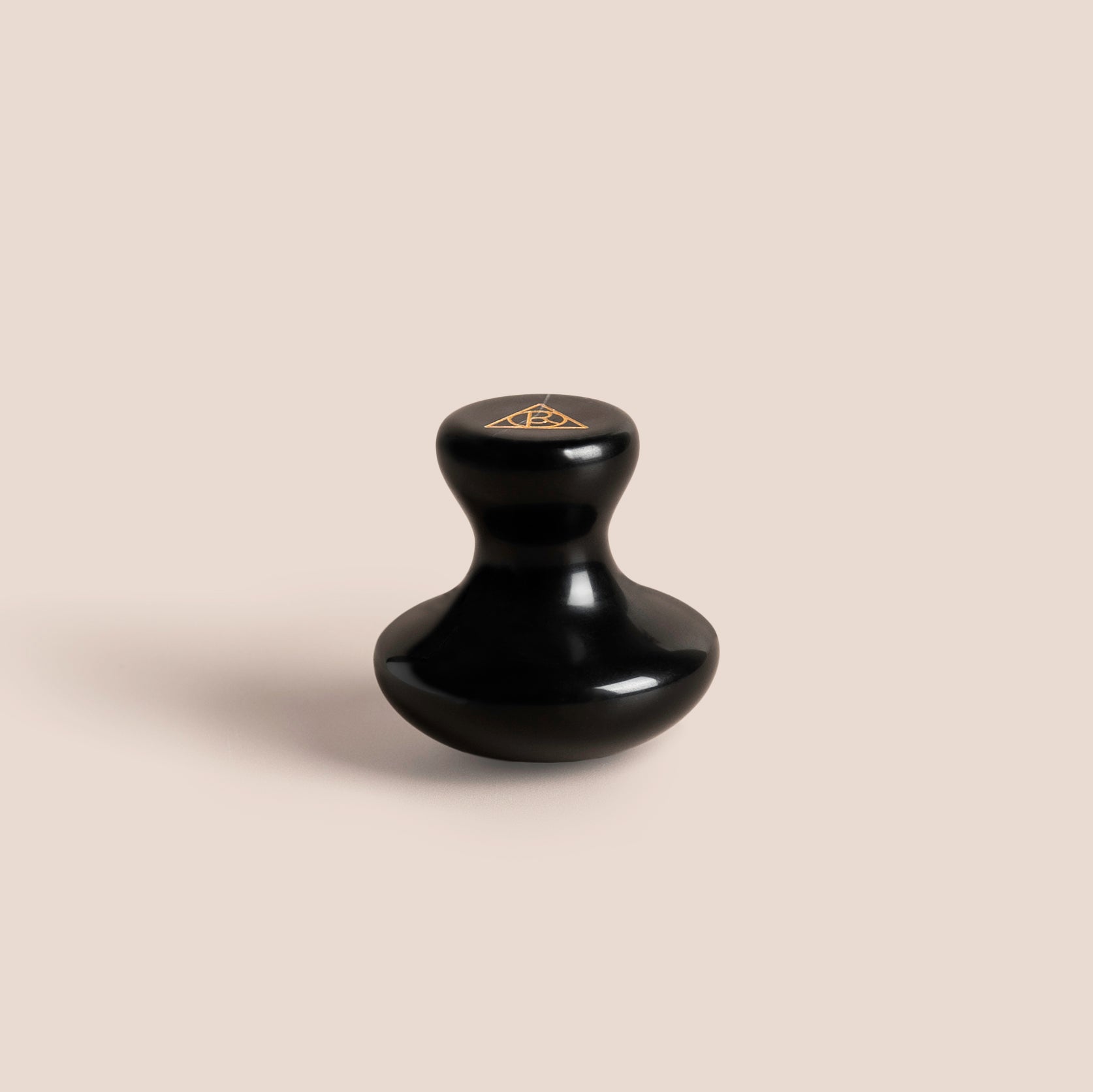 Single Cult of Reason Skincare Gua Sha Stone with pink background