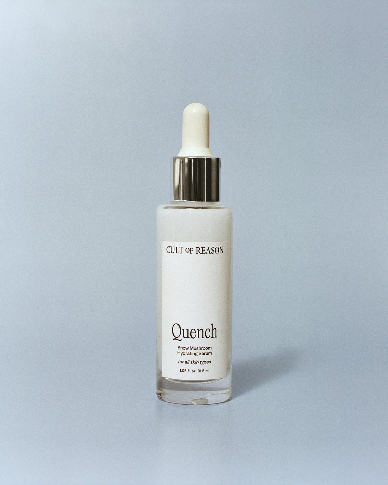 Image of Cult of Reason simple skincare product Quench, a super hydrating facial serum using Snow Mushroom as an alternative to Hyaluronic Acid for sensitive skin types, on a blue background