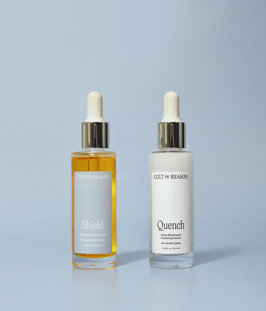 Picture of Cult of Reason skin care duo Shield, a Vitamin C and bakuchiol facial oil, and Quench, a super hydrating serum made from snow mushroom, on blue background
