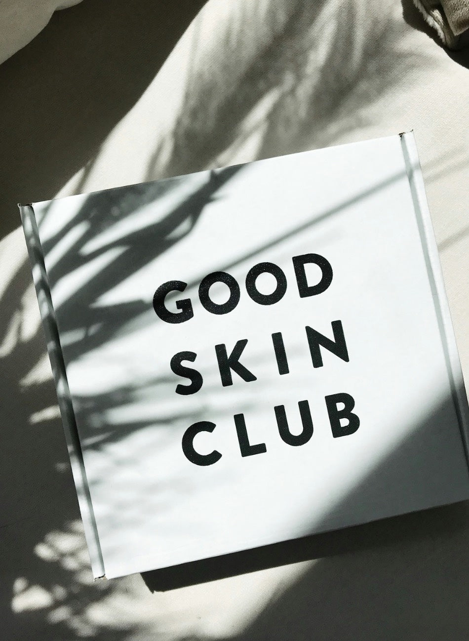 A white box is printed with words Good Skin Club in bold black sans serif font. A shadow of plant foliage is seen on the box cover. Cult of Reason skincare blog entry.