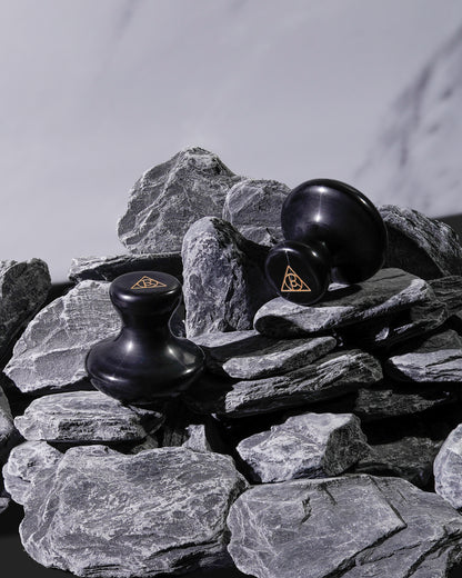 Cult of Reason Mushroom Shaped Gua Sha Stones Pictured on Stones